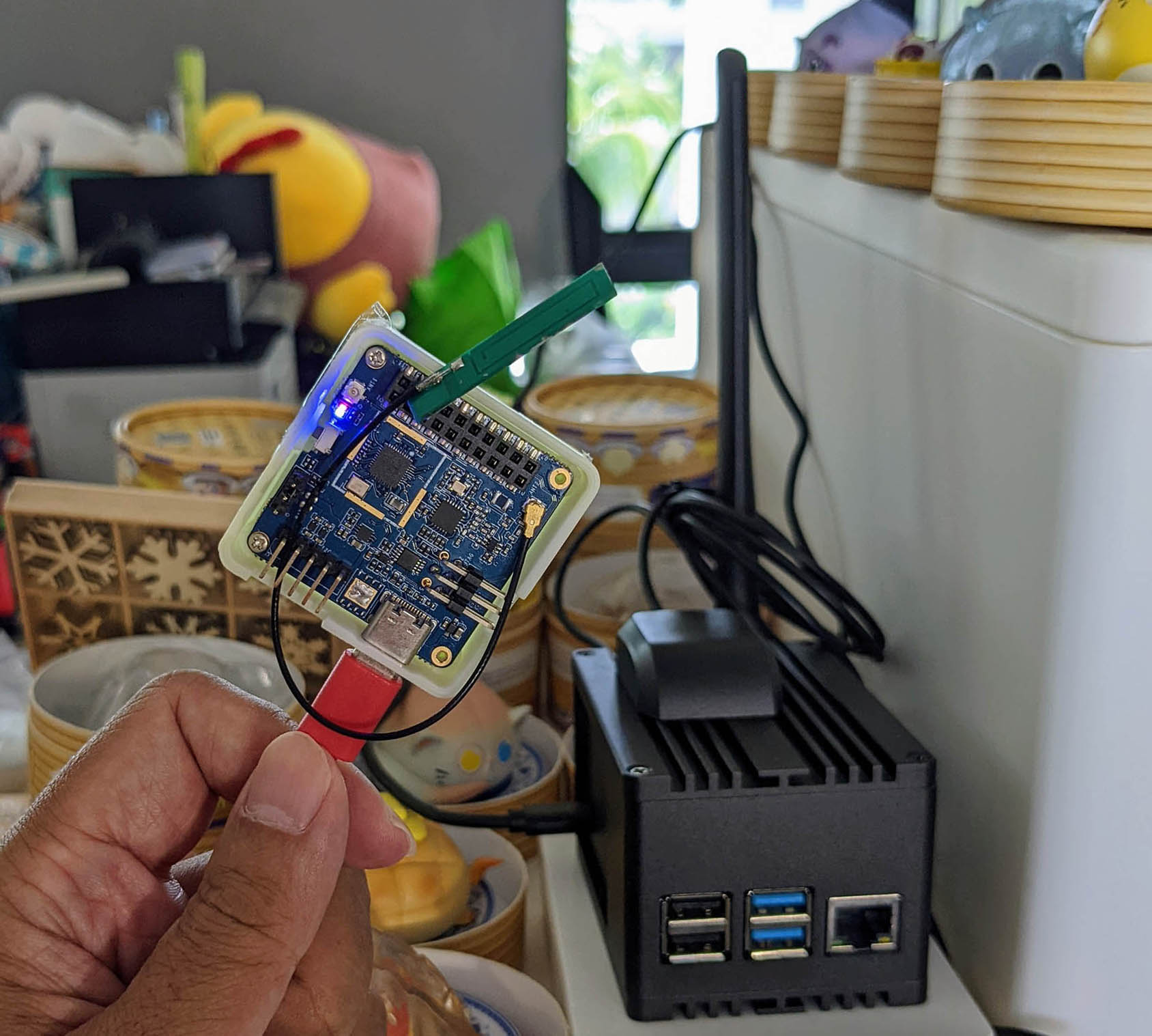 Pine64 PineDio Stack BL604 RISC-V Board (left) talking LoRaWAN on Zig to RAKwireless WisGate LoRaWAN Gateway (right)