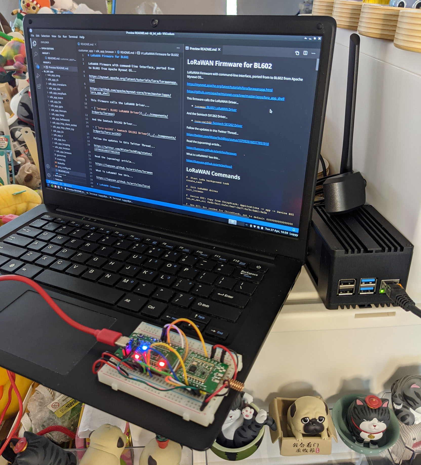 PineCone BL602 RISC-V Board with Pine64 RFM90 LoRa Module (centre), PineBook Pro (left) and RAKwireless WisGate D4H LoRaWAN Gateway (right)