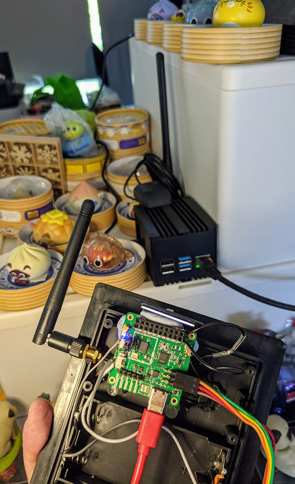 PineDio Stack BL604 RISC-V Board (foreground) talking to The Things Network via RAKWireless RAK7248 LoRaWAN Gateway (background)