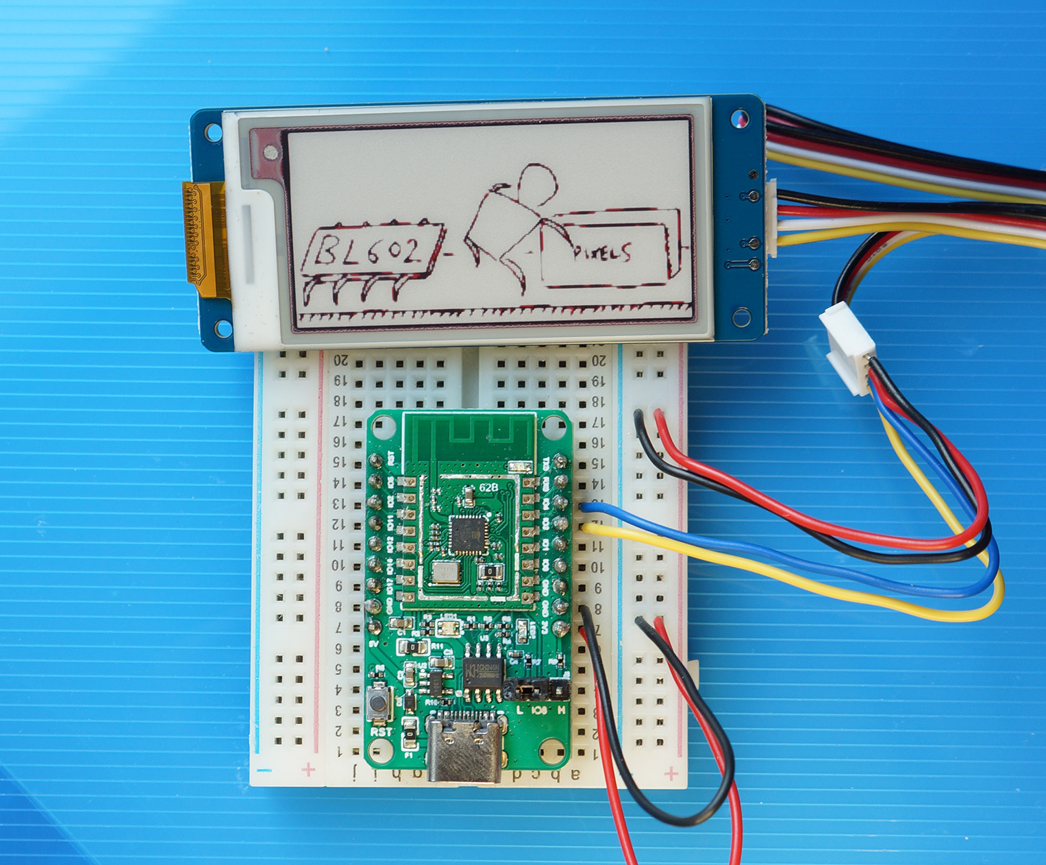 PineCone BL602 RISC-V Board rendering an image on Grove Triple Colour E-Ink Display with UART Interface